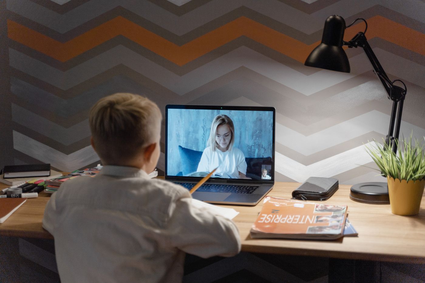 A boy attending a live online class